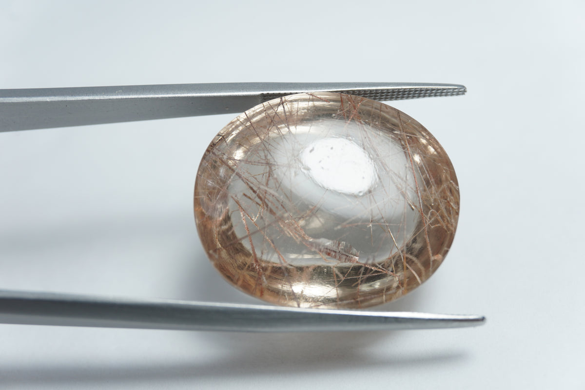 Quartzo com inclusão em cabochão 36,50ct 24x11mm