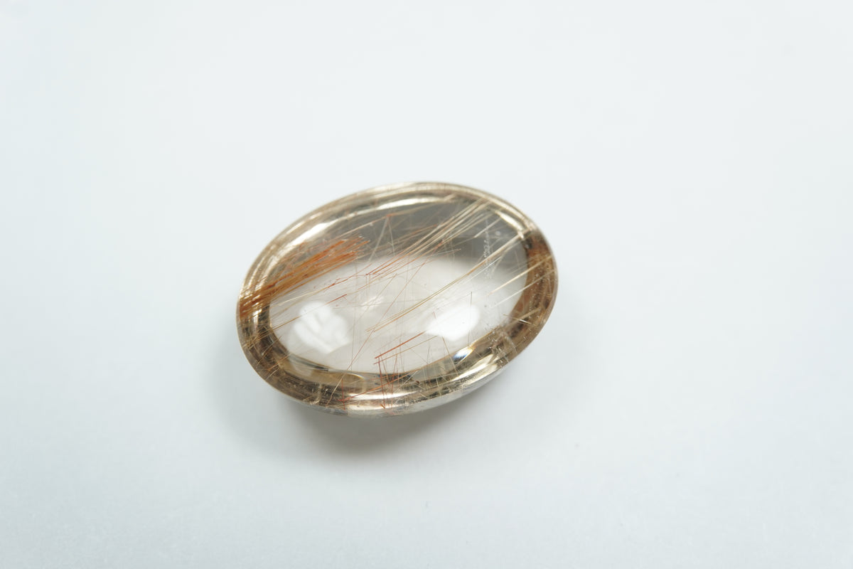 18.41ct Quartzo com rutilo cabochão 20x15mm